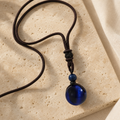 Collier Homme Œil de Faucon — Pierre 16 mm sur Cordon Tressé — photographie produit premium