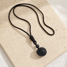 Collier Homme Pierre de Lave — Pierre 16 mm sur Cordon Tressé — photographie produit premium