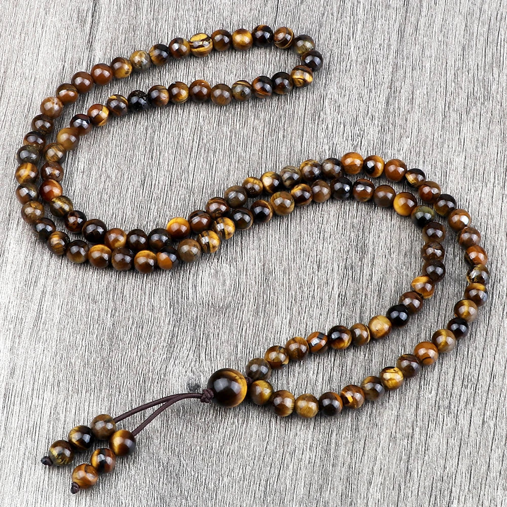 Mala œil de tigre 108 perles de 6 mm posé à plat