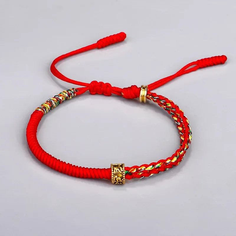 Bracelet tibétain tressé noir et perle gravée Om Mani Padme Hum