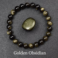 Bracelet obsidienne dorée de perles 8 mm au poignet, voile doré visible en lumière rasante