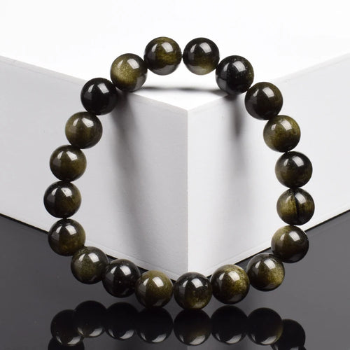 Bracelet obsidienne dorée 8 mm vu de face, reflets dorés des perles