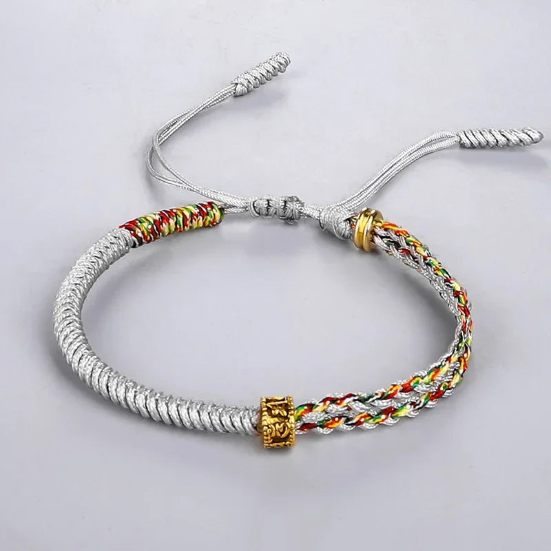 Bracelet tibétain tressé jaune safran, brin uni et brin multicolore